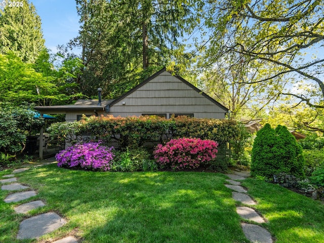 view of home's exterior featuring a lawn
