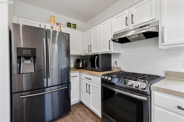 kitchen featuring light countertops, white cabinetry, under cabinet range hood, and stainless steel appliances