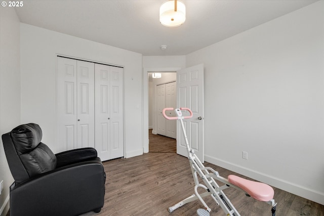 sitting room with wood finished floors and baseboards