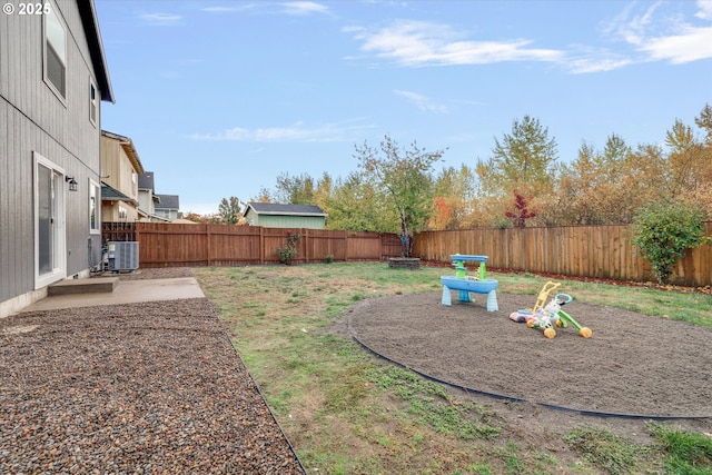 view of yard with a patio area, a fenced backyard, and cooling unit