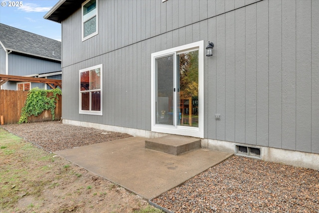 rear view of property with a patio area, visible vents, and fence