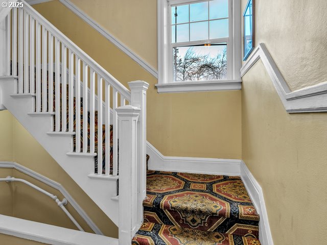 staircase with baseboards