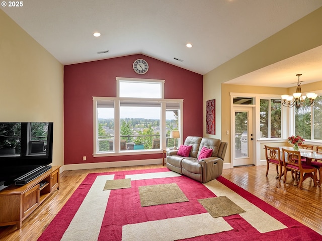 2231 SE Genesis Ct, Salem, OR 97306 - living area with a chandelier, lofted ceiling, wood finished floors, recessed lighting, and baseboards