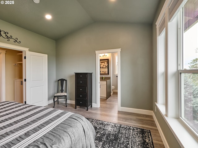 2231 SE Genesis Ct, Salem, OR 97306 - bedroom with multiple windows, wood finished floors, lofted ceiling, baseboards, and recessed lighting