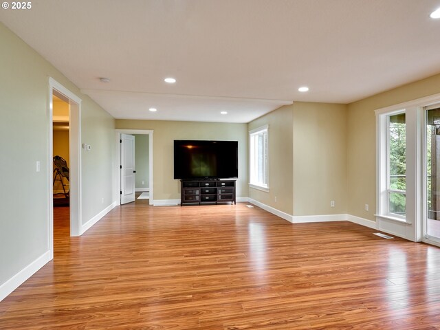 2231 SE Genesis Ct, Salem, OR 97306 - unfurnished living room with light wood finished floors, baseboards, and recessed lighting