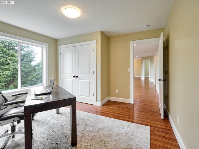 2231 SE Genesis Ct, Salem, OR 97306 - home office featuring wood finished floors, baseboards, and a textured ceiling
