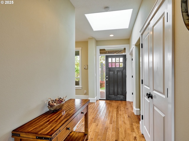 2231 SE Genesis Ct, Salem, OR 97306 - entryway with a skylight, light wood-style floors, baseboards, and recessed lighting