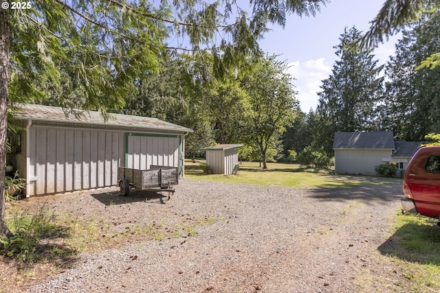 21161 S Upper Highland Rd, Beavercreek, OR 97004 - view of yard with a shed and driveway