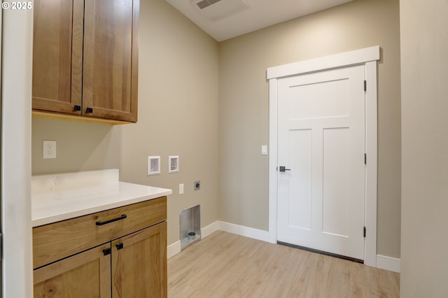 laundry room featuring washer hookup, light wood finished floors, cabinet space, hookup for an electric dryer, and baseboards