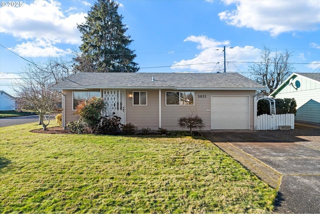 ranch-style home with a garage and a front yard