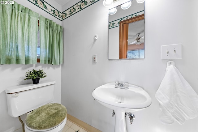 bathroom featuring ceiling fan and toilet