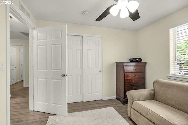 13417 NE 51st St, Vancouver, WA 98682 - living area with wood finished floors, a ceiling fan, and plenty of natural light