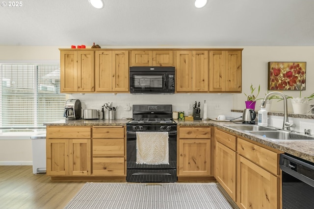 13417 NE 51st St, Vancouver, WA 98682 - kitchen with black appliances, decorative backsplash, and light wood finished floors