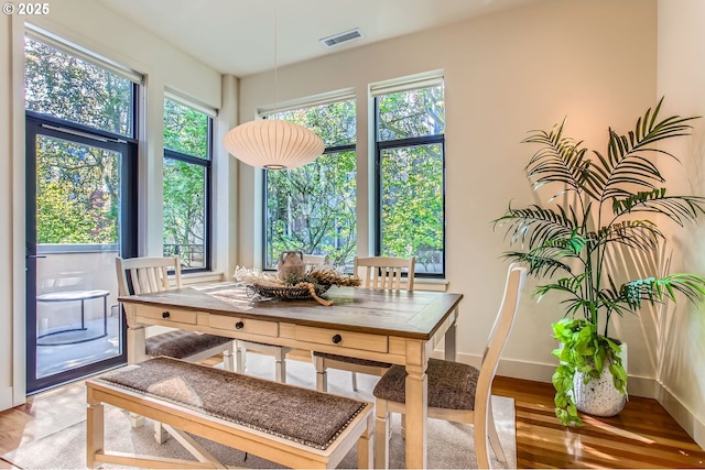 2172 NW 16th Ave, Portland, OR 97209 - dining area featuring baseboards and light wood-style floors