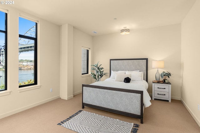 2172 NW 16th Ave, Portland, OR 97209 - carpeted bedroom featuring baseboards and a water view