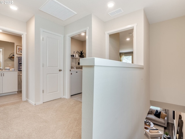10386 NE 46th St, Vancouver, WA 98682 - hallway with light colored carpet, recessed lighting, separate washer and dryer, and baseboards