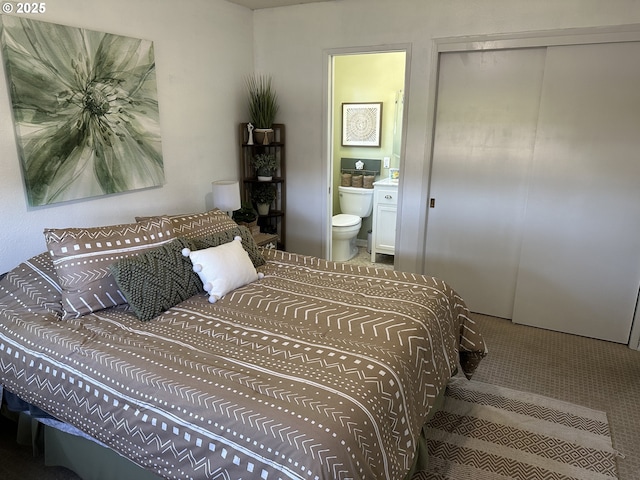 bedroom featuring ensuite bathroom and a closet