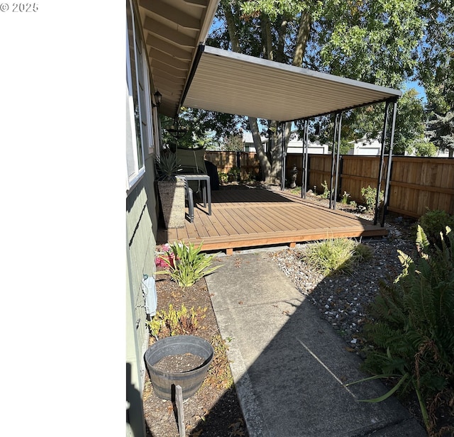 view of yard featuring a fenced backyard and a wooden deck