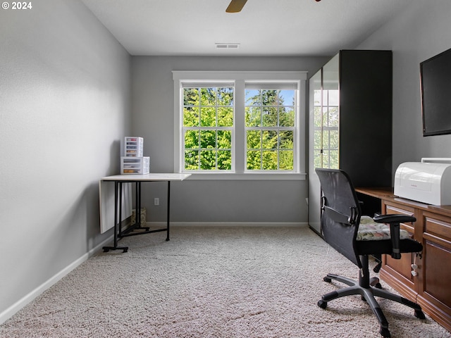 office area with a ceiling fan, carpet, visible vents, and baseboards