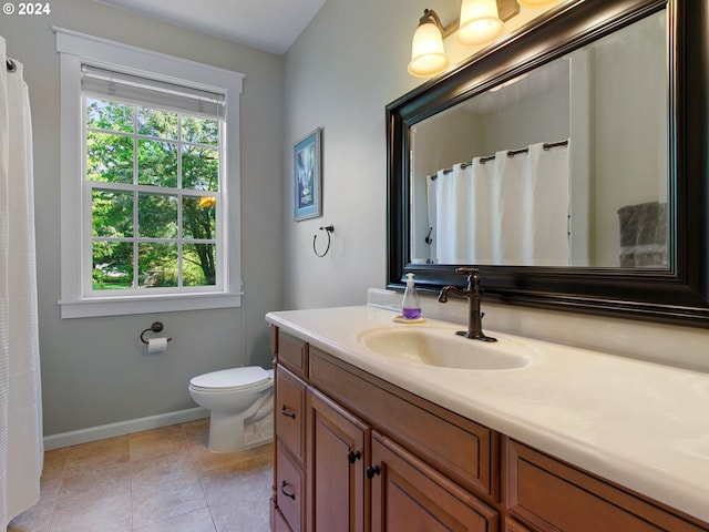 full bathroom with tile patterned flooring, vanity, toilet, and baseboards