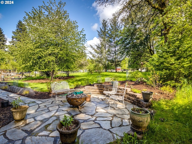 view of patio / terrace featuring a fire pit