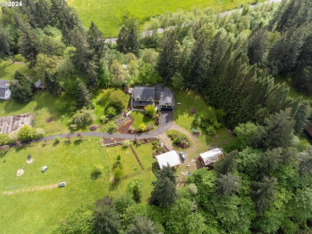 bird's eye view featuring a wooded view