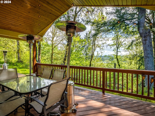 wooden deck featuring outdoor dining space