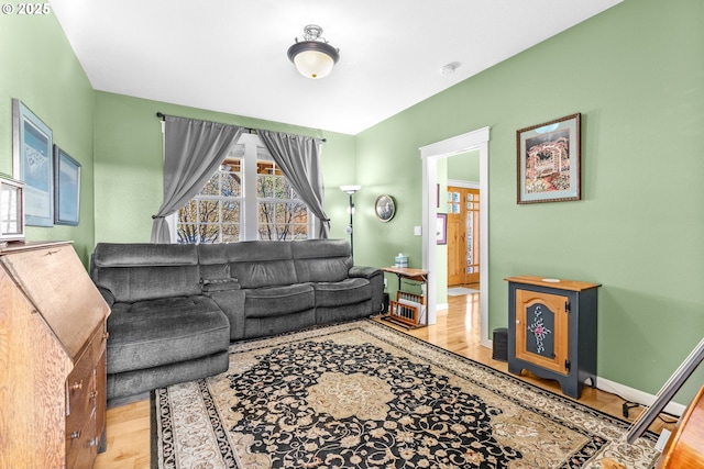 living area featuring wood finished floors and baseboards