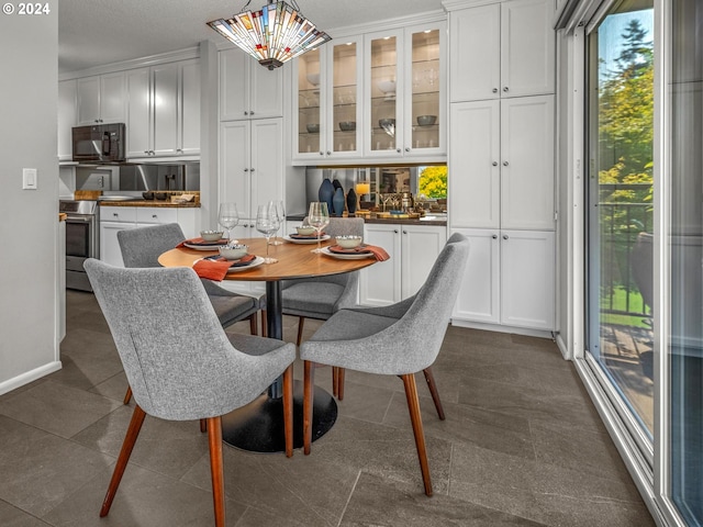 dining area featuring baseboards