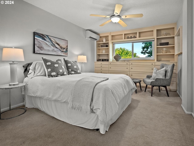 bedroom with a wall unit AC, ceiling fan, light carpet, and baseboards