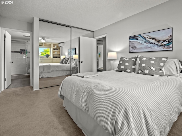 bedroom with carpet, a closet, and a textured ceiling