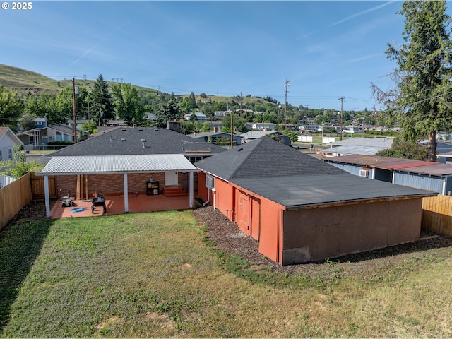 1911 E 12th St, The Dalles, OR 97058 - rear view of house with a patio