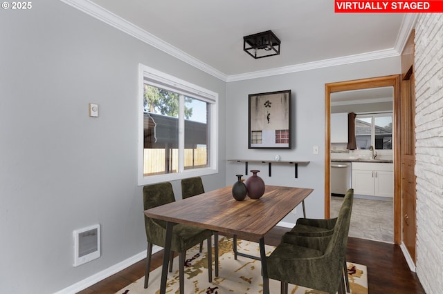 1911 E 12th St, The Dalles, OR 97058 - dining area with dark wood-style flooring, ornamental molding, heating unit, and baseboards