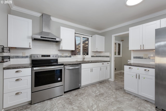 1911 E 12th St, The Dalles, OR 97058 - kitchen with wall chimney exhaust hood, stainless steel appliances, a sink, white cabinets, and crown molding