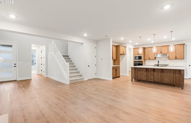 8710 S 3rd St, Ridgefield, WA 98642 - kitchen with built in microwave, oven, open floor plan, light countertops, and recessed lighting