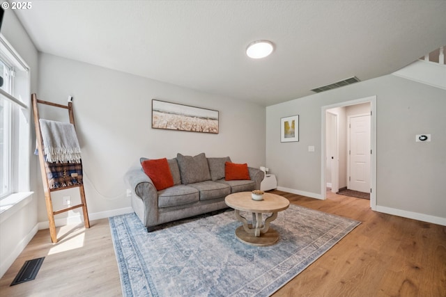 1686 NE 27th Ter, Gresham, OR 97030 - living area with plenty of natural light and light wood-type flooring