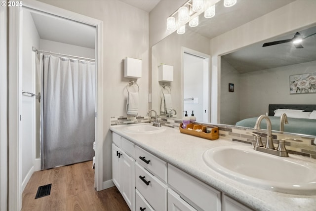1686 NE 27th Ter, Gresham, OR 97030 - bathroom featuring double vanity and wood finished floors
