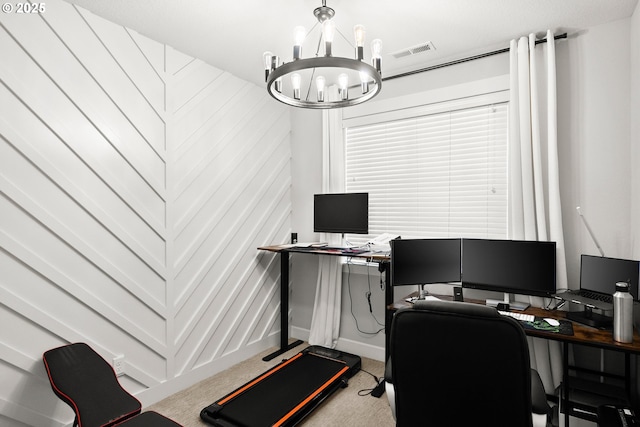 carpeted home office with visible vents and a notable chandelier