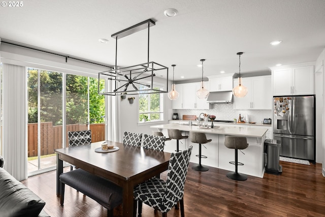 dining area featuring recessed lighting and dark wood finished floors