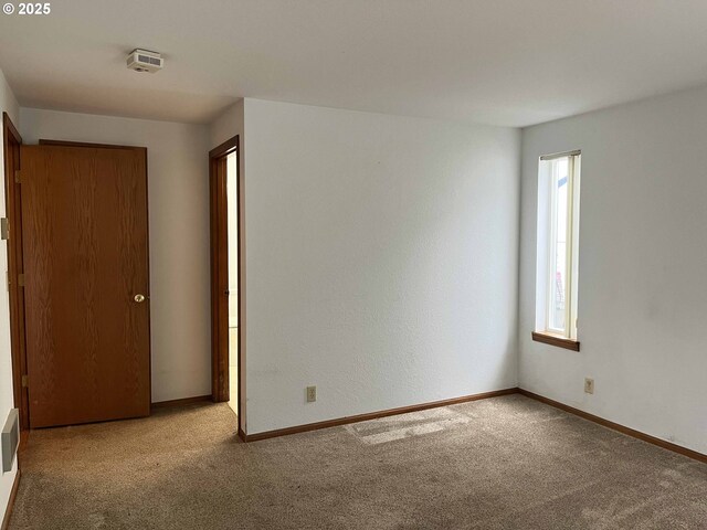 4040 Munsel Creek Dr, Florence, OR 97439 - empty room featuring baseboards and carpet flooring
