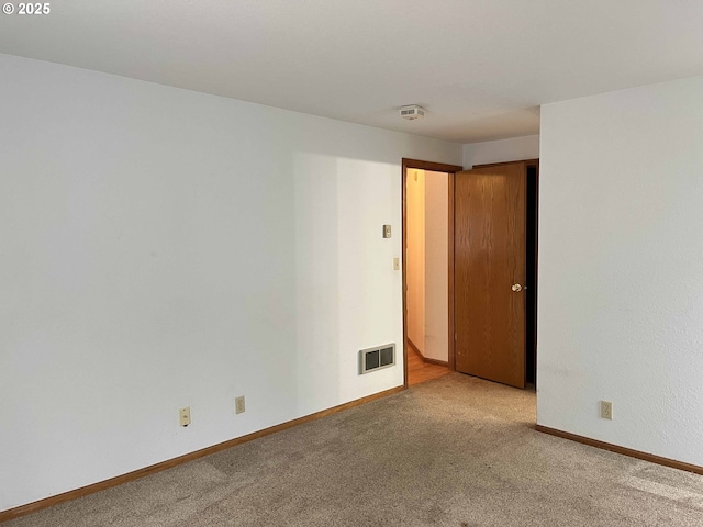 4040 Munsel Creek Dr, Florence, OR 97439 - empty room featuring carpet floors, baseboards, and visible vents