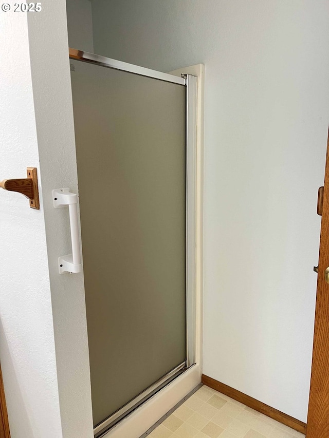 4040 Munsel Creek Dr, Florence, OR 97439 - full bath with a stall shower, baseboards, and tile patterned floors