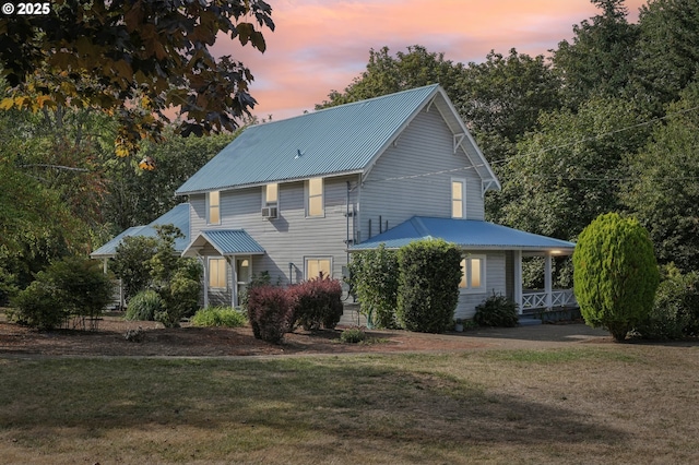 view of front of home with a lawn