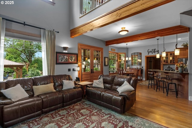 106 Green Valley Rd, Oakland, OR 97462 - living area featuring wood finished floors, beam ceiling, and a chandelier