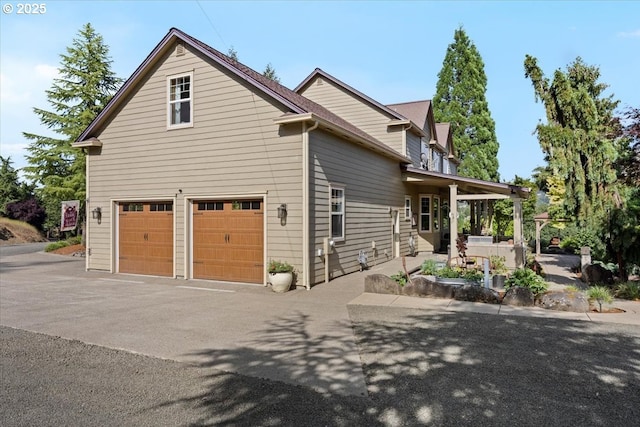 106 Green Valley Rd, Oakland, OR 97462 - view of side of property featuring a garage and driveway
