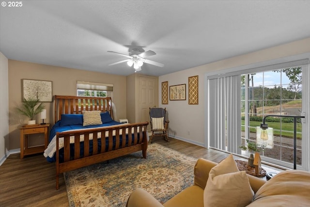 106 Green Valley Rd, Oakland, OR 97462 - bedroom with wood finished floors, a ceiling fan, and access to outside