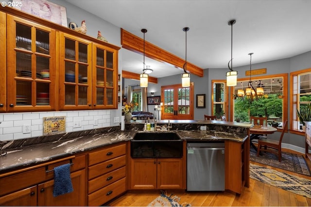 106 Green Valley Rd, Oakland, OR 97462 - kitchen with stainless steel dishwasher, light wood finished floors, decorative backsplash, decorative light fixtures, and beam ceiling