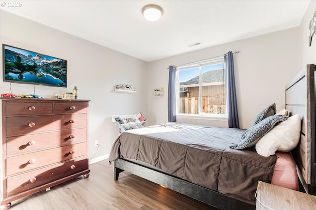 bedroom featuring hardwood / wood-style flooring