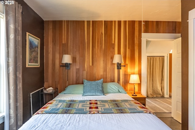 bedroom with wood walls