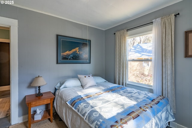 bedroom featuring ornamental molding and baseboards